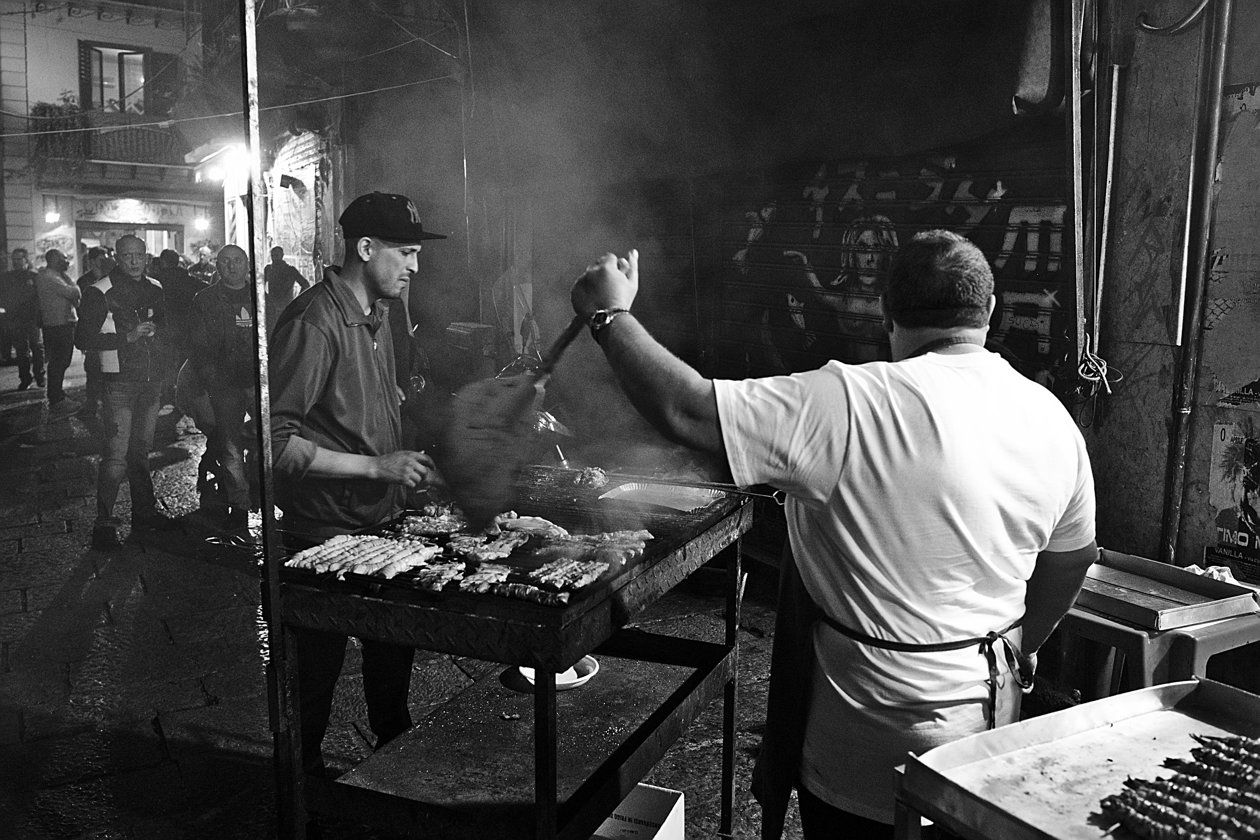 Man grilling stigghiola